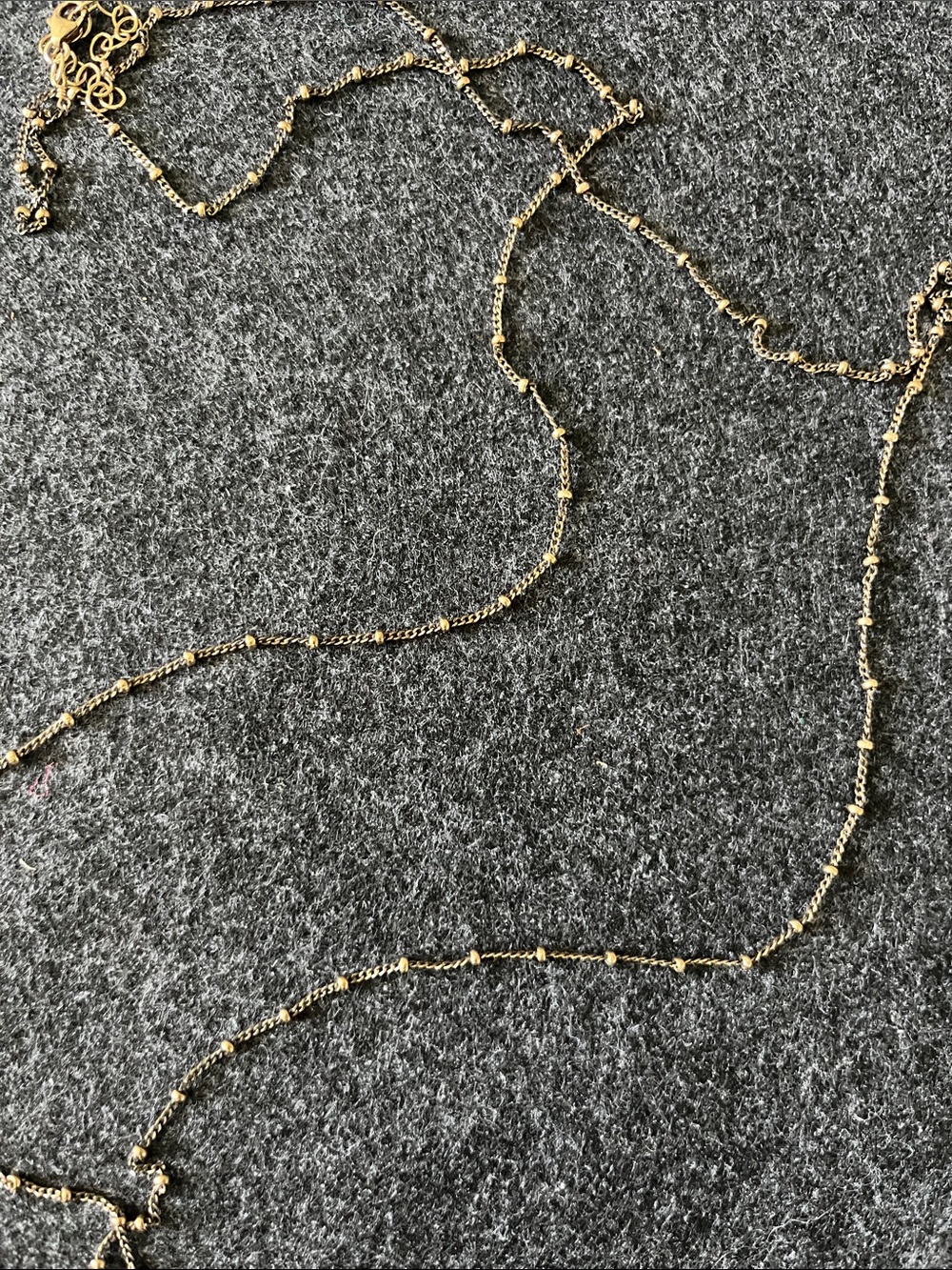 LONG NECKLACE WITH GOLD BEADS DETAIL